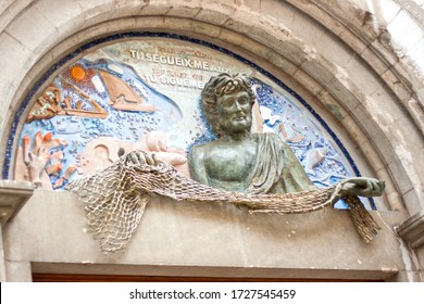 Figueres Spain April 08. 2009.   Jesus Said To Saint Peter “Follow Me”. Relief On The Facade Of St. Peter's Church With A Quote From Jesus Christ, Next To The Dalí Theatre And Museum.