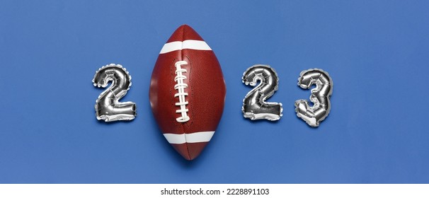 Figure 2023 made of balloons and rugby ball on blue background - Powered by Shutterstock