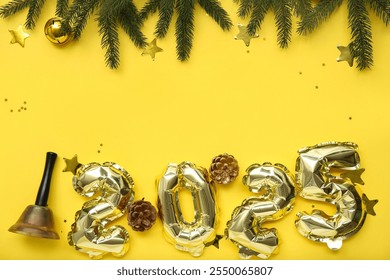 Figure 2025 made of foil balloons with jingle bell, pine cones and Christmas tree branches on yellow background - Powered by Shutterstock