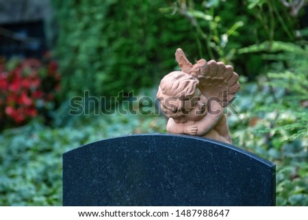 Figure of an angel on a tombstone