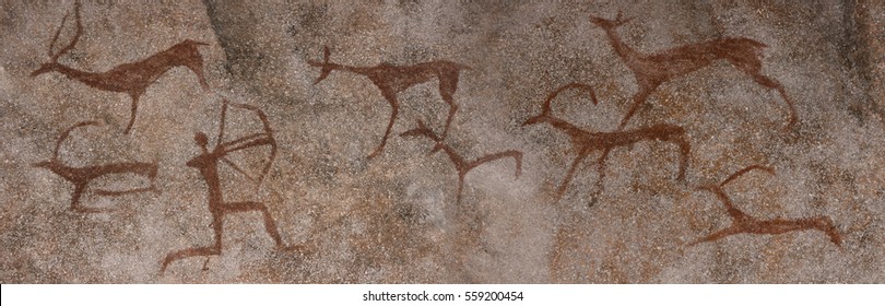 Figure Animals And Hunter On The Stone Wall Of The Cave Paint Ocher Ancient Prehistoric Neanderthal. Prehistoric Animal, Stone Age Hunting For Deer. Primitive Man