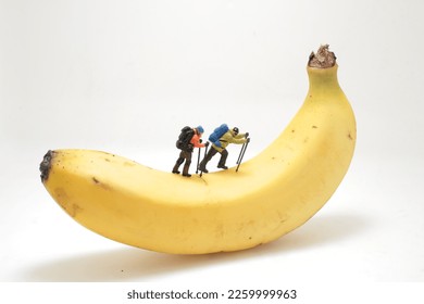 a figure climb and hikers on the banana - Shutterstock ID 2259999963