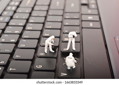 The Figure Of Crime Scene Investigation On Keyboard. Cyber Crimes Concept. Selective Focus.