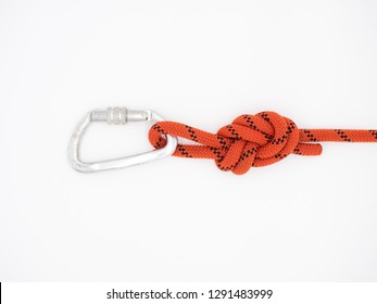 Figure eight knot with carabiner. Silver carabiner with lock and red rope isolated on white.