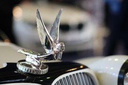 Figure Of Flying Angel On Thetop Of Car Hood. Objects At Vintage Car Show