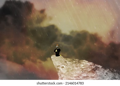 A Figure Kneeling and Praying on the Hill under the Rain 