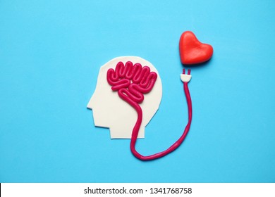 Figure Of Man With Brain And Red Heart. Love And Intelligence.