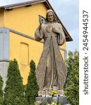 Figure of Merciful Jesus next to the church and cemetery in Góra Swietej Malgorzata (Mount of Saint Margaret) in Poland.