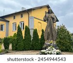 Figure of Merciful Jesus next to the church and cemetery in Góra Swietej Malgorzata (Mount of Saint Margaret) in Poland.