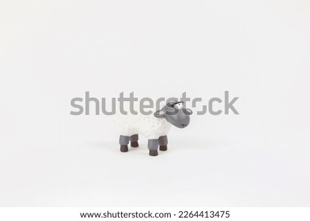 figure of a sheep, a children's toy on a white background