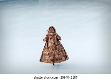 Figure Skater On Ice. The Girl Is Skating. Ice Under The Open Sky. No Makeup In Winter, Red Cheeks