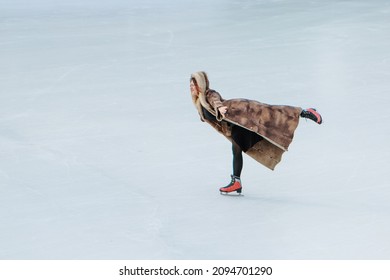 Figure Skater On Ice. The Girl Is Skating. Ice Under The Open Sky. No Makeup In Winter, Red Cheeks