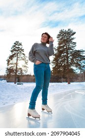 Figure Skater On Ice. The Girl Is Skating. Ice Under The Open Sky. No Makeup In Winter, Red Cheeks