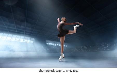 Figure Skating Couple In Professional Ice Arena.