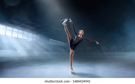 Figure Skating Couple In Professional Ice Arena.