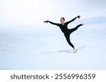 Figure skating girl on professional ice arena.