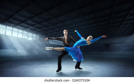 Figure Skating Pair In Ice Arena