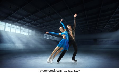 Figure Skating Pair In Ice Arena