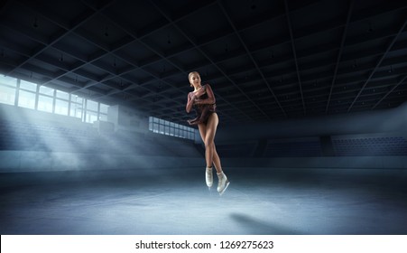 Figure Skating Pair In Ice Arena