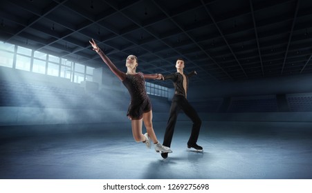 Figure Skating Pair In Ice Arena