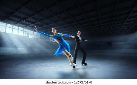 Figure Skating Pair In Ice Arena