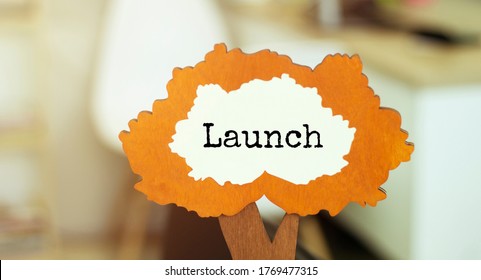 figure of a tree with text launch inside the foliage. Business concept
