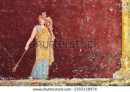 Figure of a woman painted in a Fresco in a Domus of Pompeii, Italy