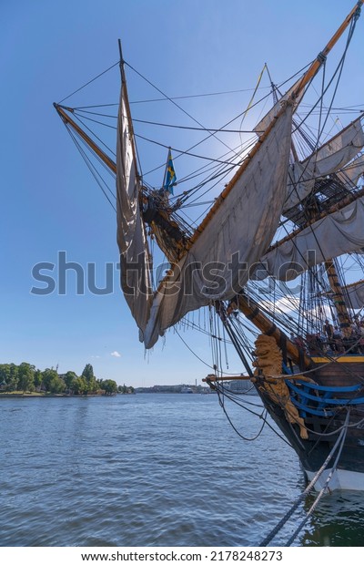 Figurehead and sails on the replica of the old\
Indian Man Götheborg, at the old town Gamla Stan, for the East\
India arriving to Shanghai 2023, a sunny summer day in Stockholm,\
Sweden 2022-07-13