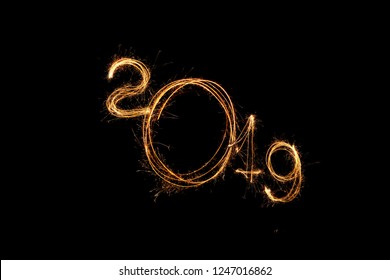 Figures 2019 new year. Bengal Spark Inscription. Sparklers draw figures 2019. Bengal lights and letter - Powered by Shutterstock