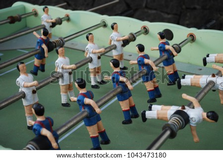 Figures of football players from metal, in blue-red form. Table soccer.