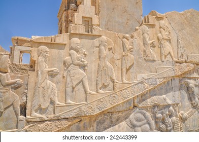 Figures on walls of ancient persian capital Persepolis in current Iran