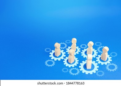 Figures of people interact with gears. Joining efforts and cooperation. Corporate machine. Communication in running company. Goal achievement. Joint development. Join team group. Teamwork - Shutterstock ID 1844778163
