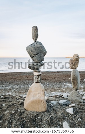 Figures of stones on the beach. Beautiful figures of stones on the background of the sea.