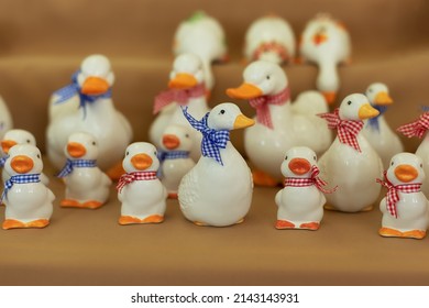 Figurine colorful birds. Ceramic figurine of ducks. Close-up of white statuette of ducks. Porcelain duck. Ceramic figurine of wild bird. Goose, duck, drake