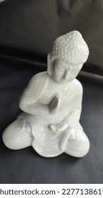 figurine figurine decorative decor interior object religion Buddha white porcelain stone black backgroun