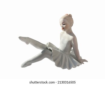 figurine doll ballerina. little girl in a tutu and pointe. isolated on white - Shutterstock ID 2130316505