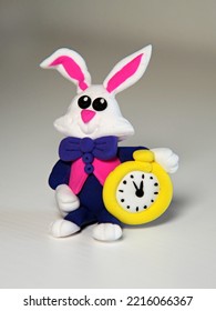 Figurine Of Mad March Hare, White Rabbit With A Clock Made Of Air Plasticine, Clay. Handmade. Sculpt With Children. 