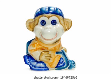 Figurine Of A Playful Monkey With A Backpack And A Baseball Cap. Pencil Holder. Painted With Porcelain Paints. Collectibles. Swap Meet. Antiques, Art. White Ceramic Translucent Ceramic; China.
