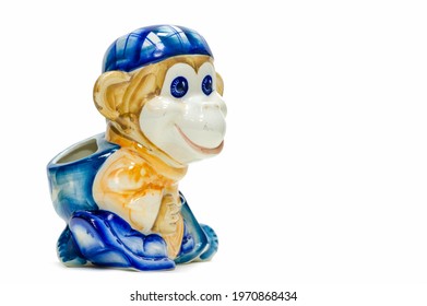 Figurine Of A Playful Monkey With A Backpack And A Baseball Cap. Pencil Holder. Painted With Porcelain Paints. Collectibles. Swap Meet. Antiques, Art. White Ceramic Translucent Ceramic; China.
