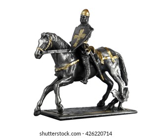 Figurine Of Rodrigo Diaz De Vivar On A Horse Isolated On White Background                               