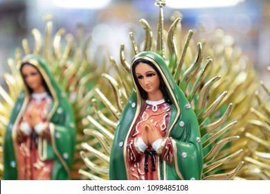Figurine of the Virgin of Guadalupe sold on nearby stalls