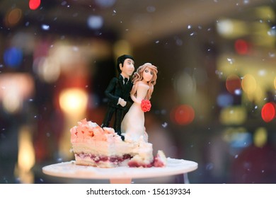 figurines of the bride and groom on a wedding cake