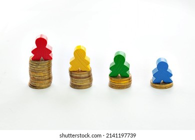 figurines of men on stacks of coins, the concept of social inequality, different wages, investments and career growth - Powered by Shutterstock