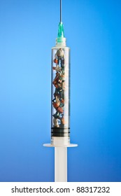 Figurines placed inside syringe