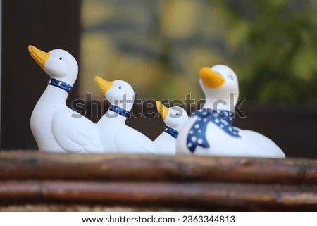 Figurines of white birds. Ceramic duck figurine.