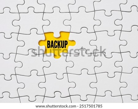File or computer data backup and recovery. Business backup plan. The word backup written on the missing piece of a jigsaw puzzle.