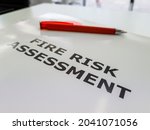A file containing the Fire Risk Assessment, a legal requirement in the UK to assess and reduce the rise of fire for commercial properties, blocks of flats and workplaces.