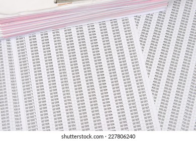 a file folder with documents on a chart number