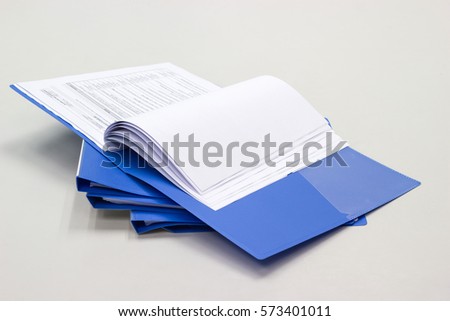 file folder with documents and documents. retention of contracts on the table 