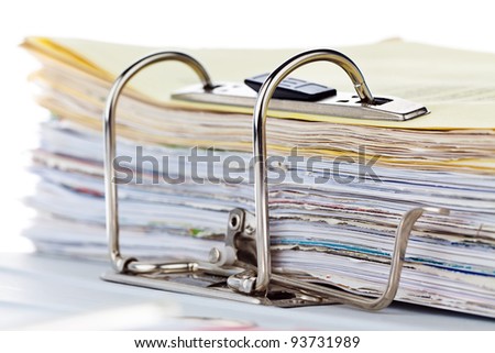 a file folder with documents and documents. retention of contracts.